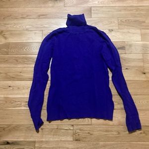 Ricki’s royal blue turtleneck sweater